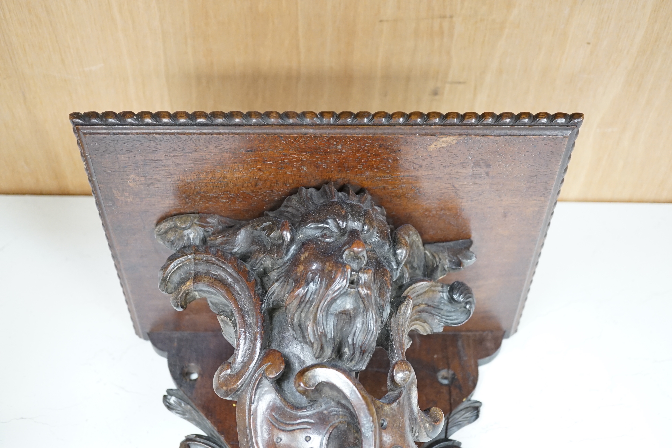 A 19th century carved walnut wall bracket, 41cm